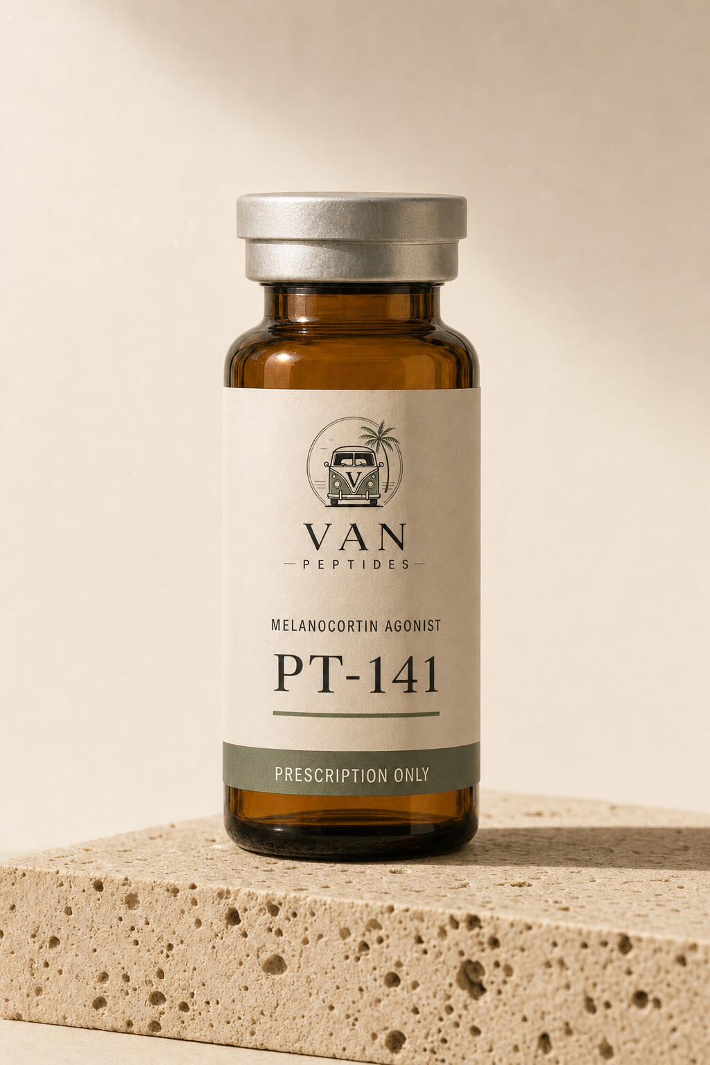 Amber apothecary vial with a cream label reading PT-141, Prescription Only, on a travertine surface