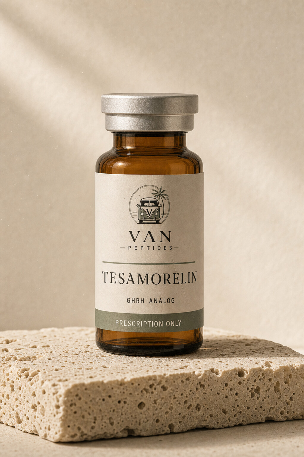 Amber apothecary vial with a cream label reading Tesamorelin, Prescription Only, on a travertine surface