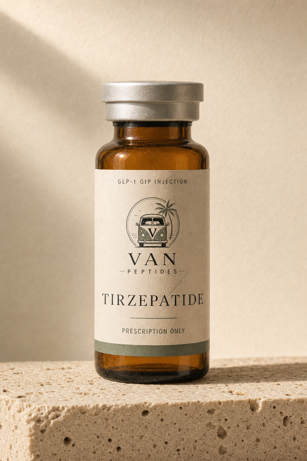 Amber apothecary vial with a cream label reading Tirzepatide, on a travertine surface